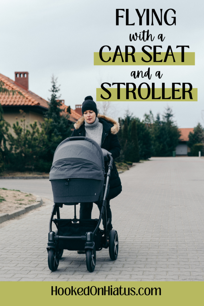 woman pushing a baby in a stroller while on vacation.