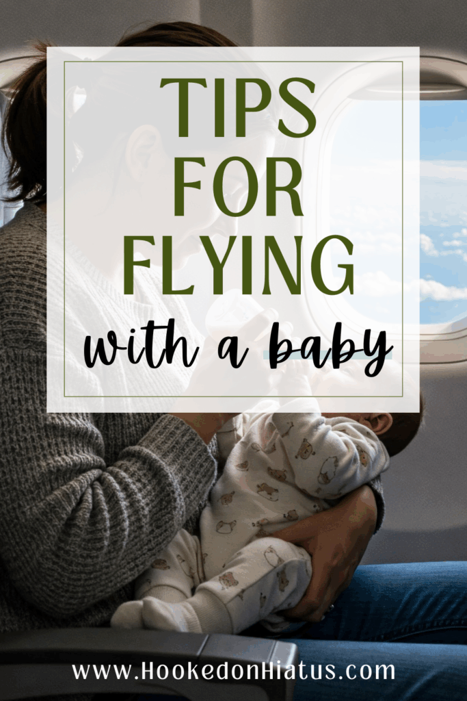 mom feeding baby on plane