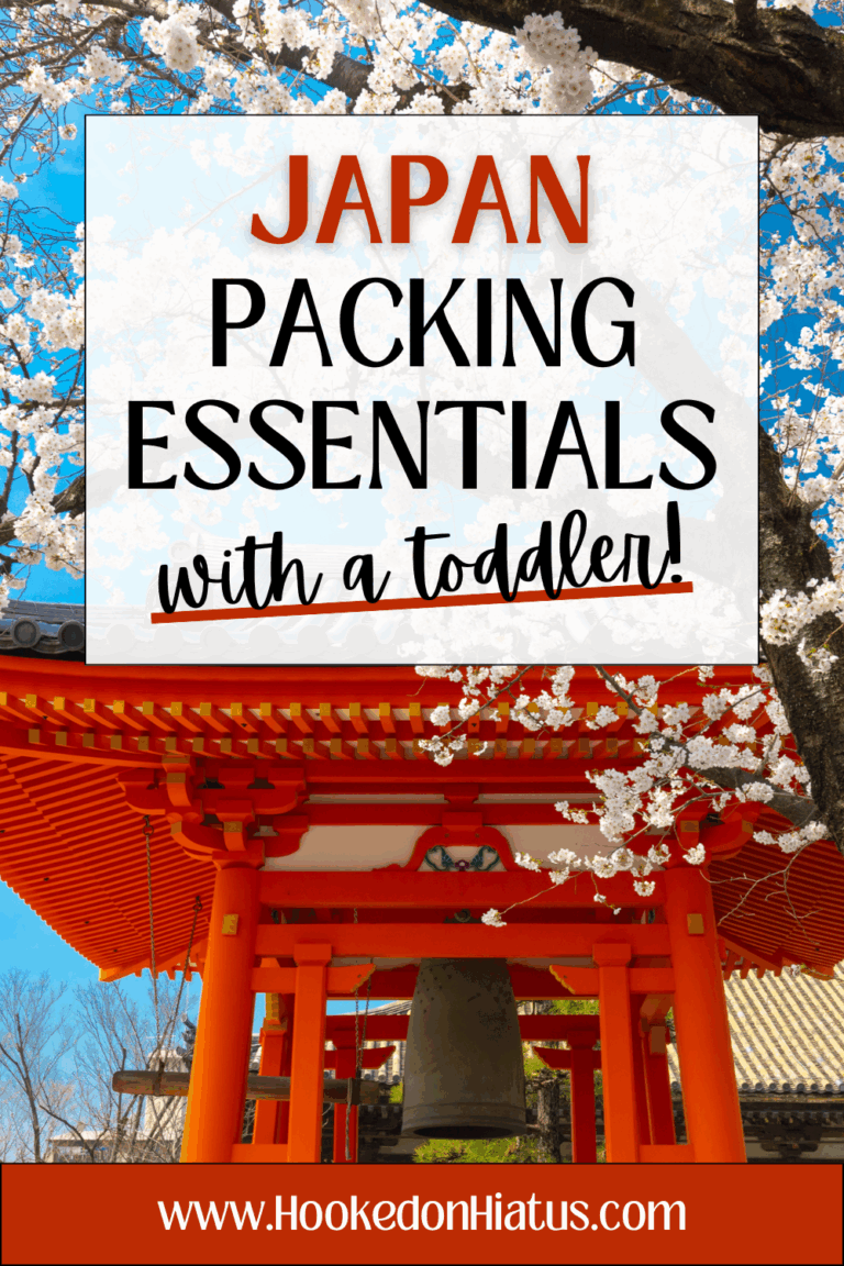red Shinto shrine torii gates with white cherry blossoms in Japan in spring. toddler packing list for Japan.