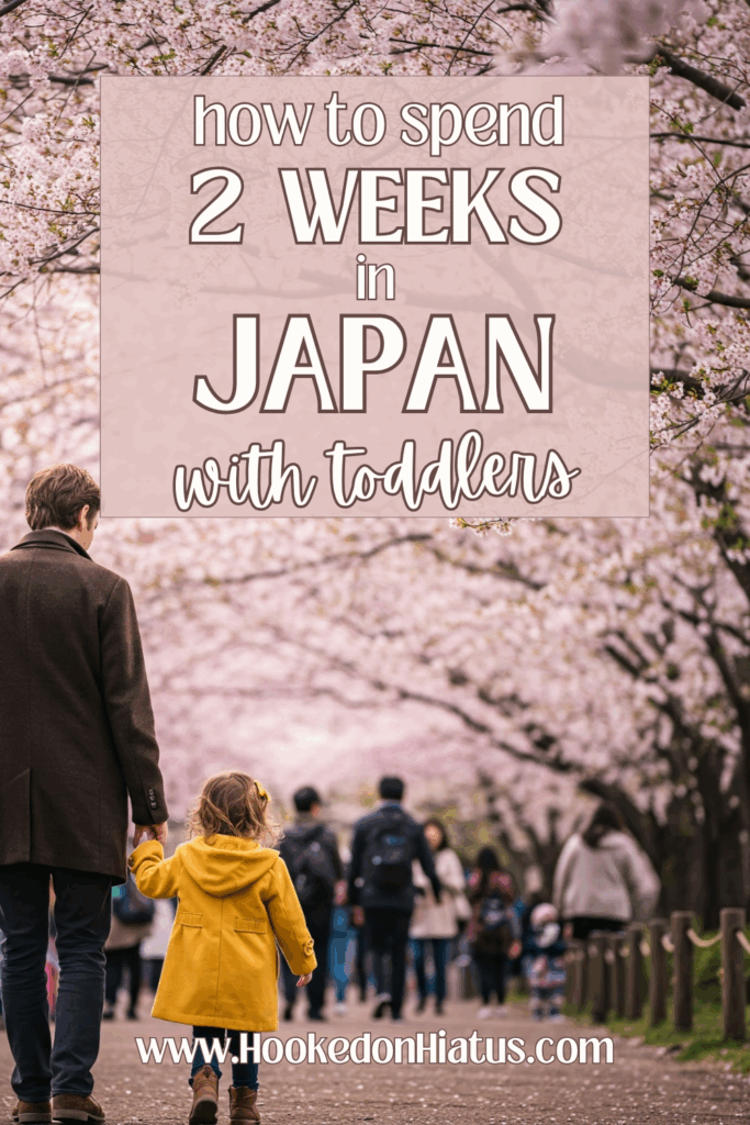 Pinterest-www.hookedonhiatus.com-Japan itinerary with toddlers 2 toddler walking with dad under cherry blossoms