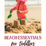 toddler playing in sand on beach