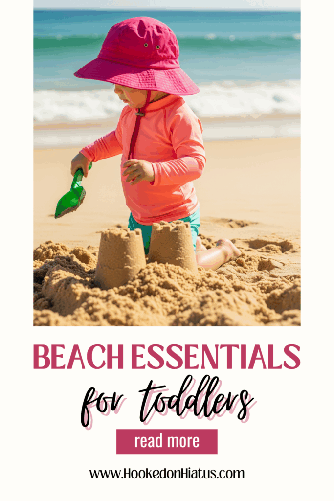 toddler playing in sand on beach