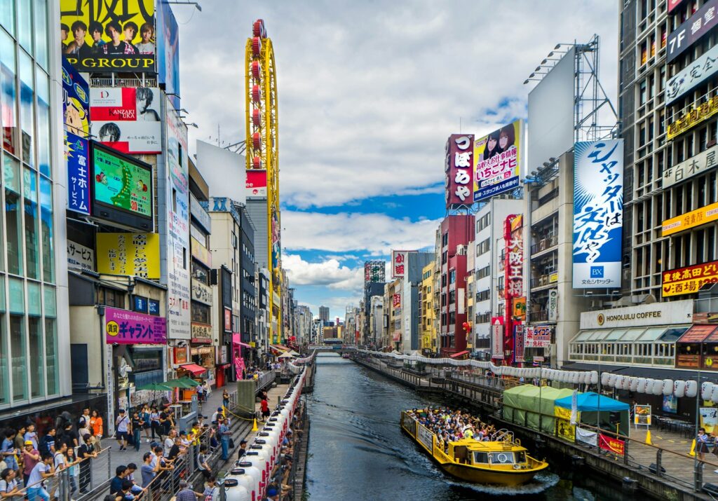Photo by Richard Tao people walking on street near buildings during daytime