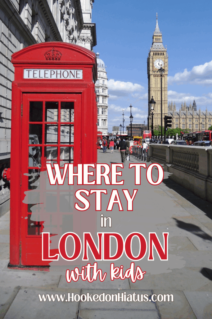 red telephone booth with clock tower in background