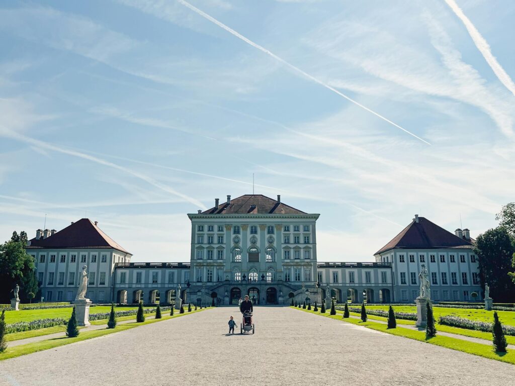 toddler walking with travel stroller in Munich