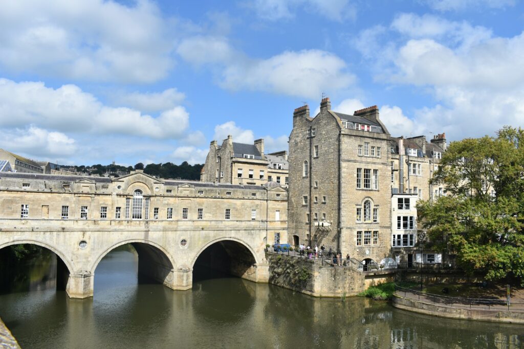 a bridge over a body of water in front of a building