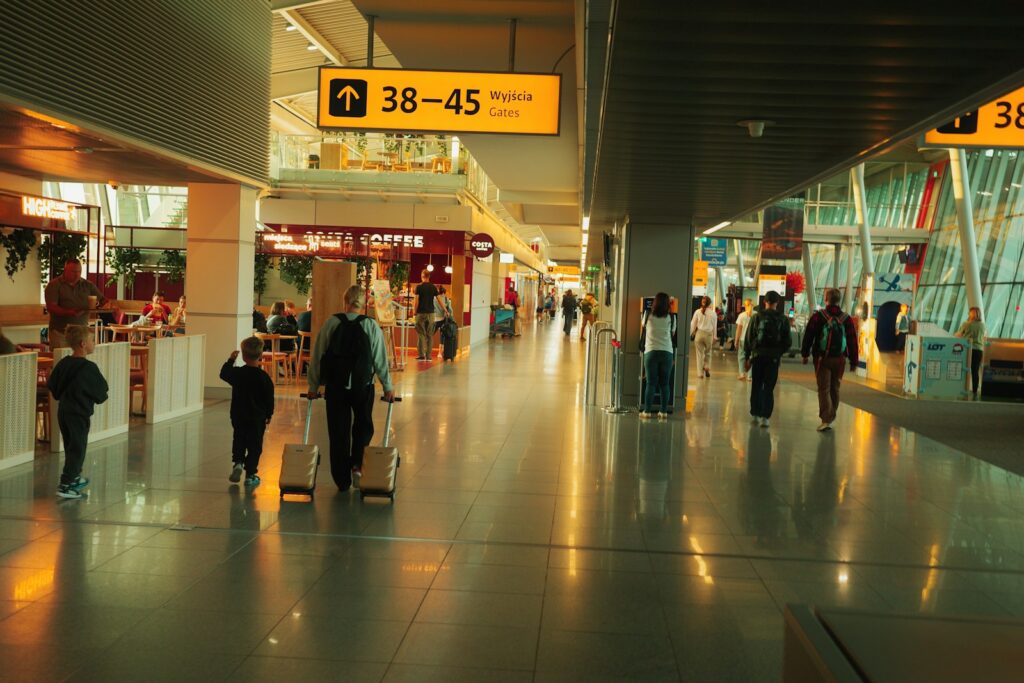 People walking through a modern airport terminal