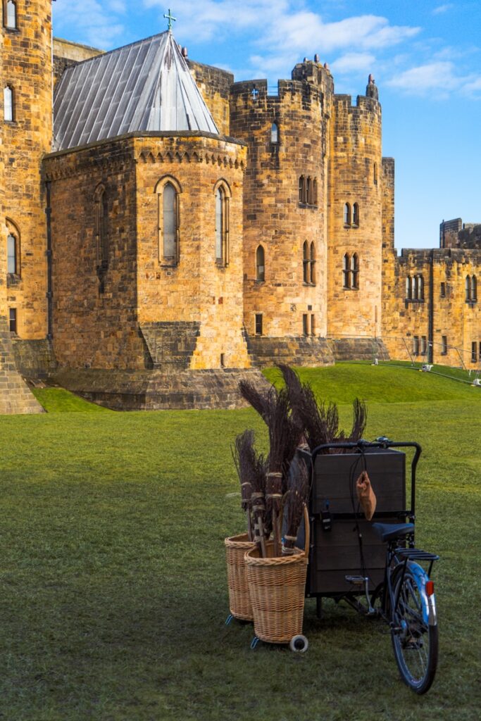 a bike parked in front of a castle