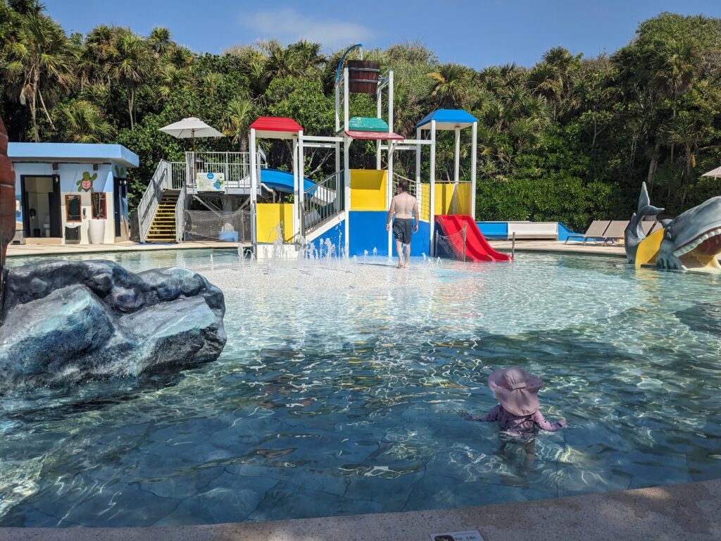 toddler and man at waterpark at all inclusive resort